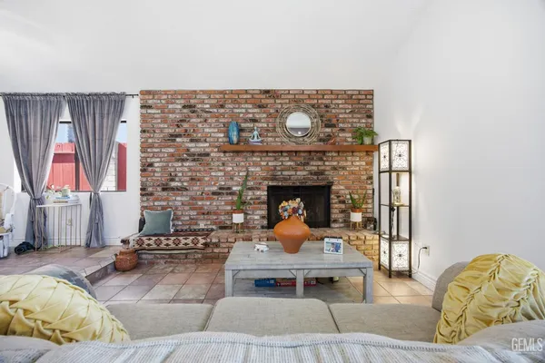 a fireplace with a vase on top of it