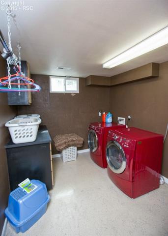 2007 North Chelton Road Colorado Springs, CO 80909 - Photo 29 of 35 The laundry room has nicely painted walls. There are two areas that provide cabinet space, and it is plenty large for a big family.