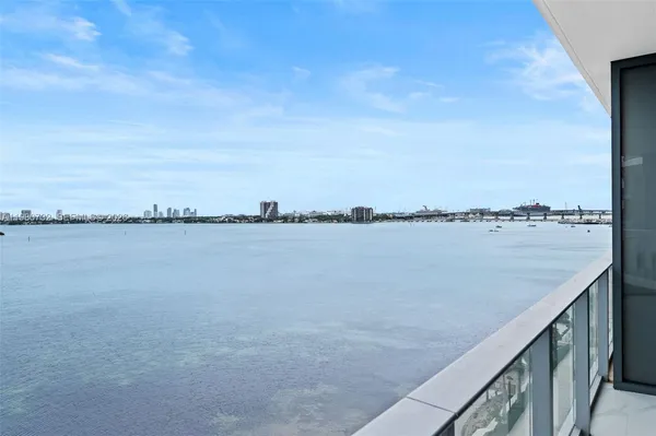 a view of a lake from a balcony