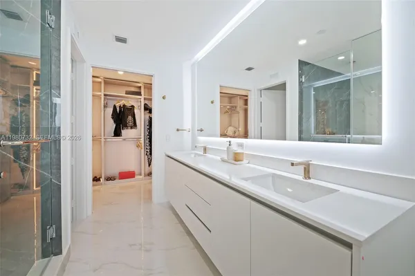 a bathroom with a toilet and a shower curtain