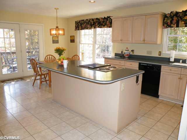 20141 Ivan Road Petersburg, VA 23803 - Photo 8 of 12 Kitchen - Huge (20x15) Gourmet Kitchen with Corian Countertops, tile flooring, large Island with downdraft cooktops, pantry and lots of cabinet space