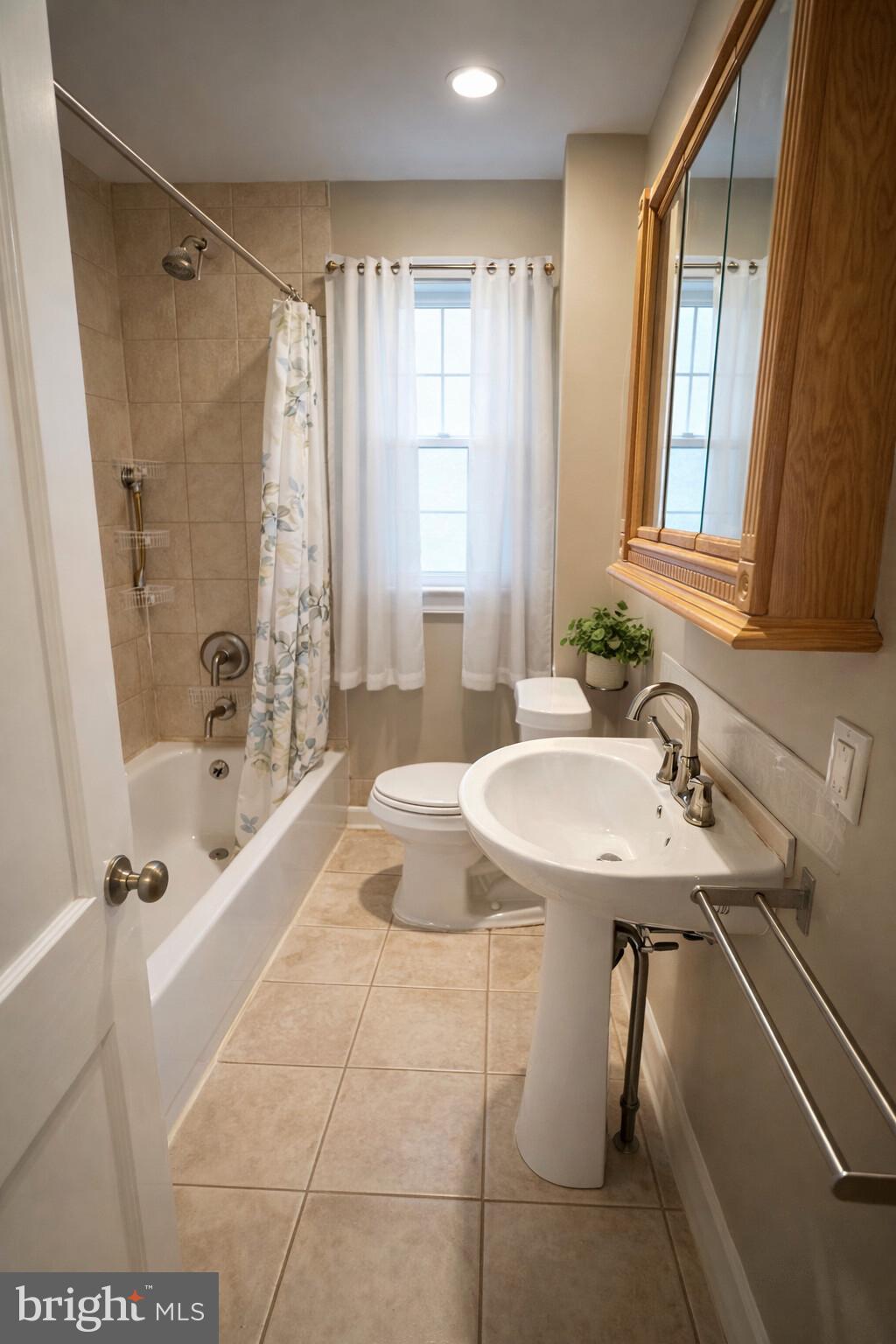 447 West Chester Pike Havertown, PA 19083 - Photo 12 of 16 a bathroom with a tub sink and mirror