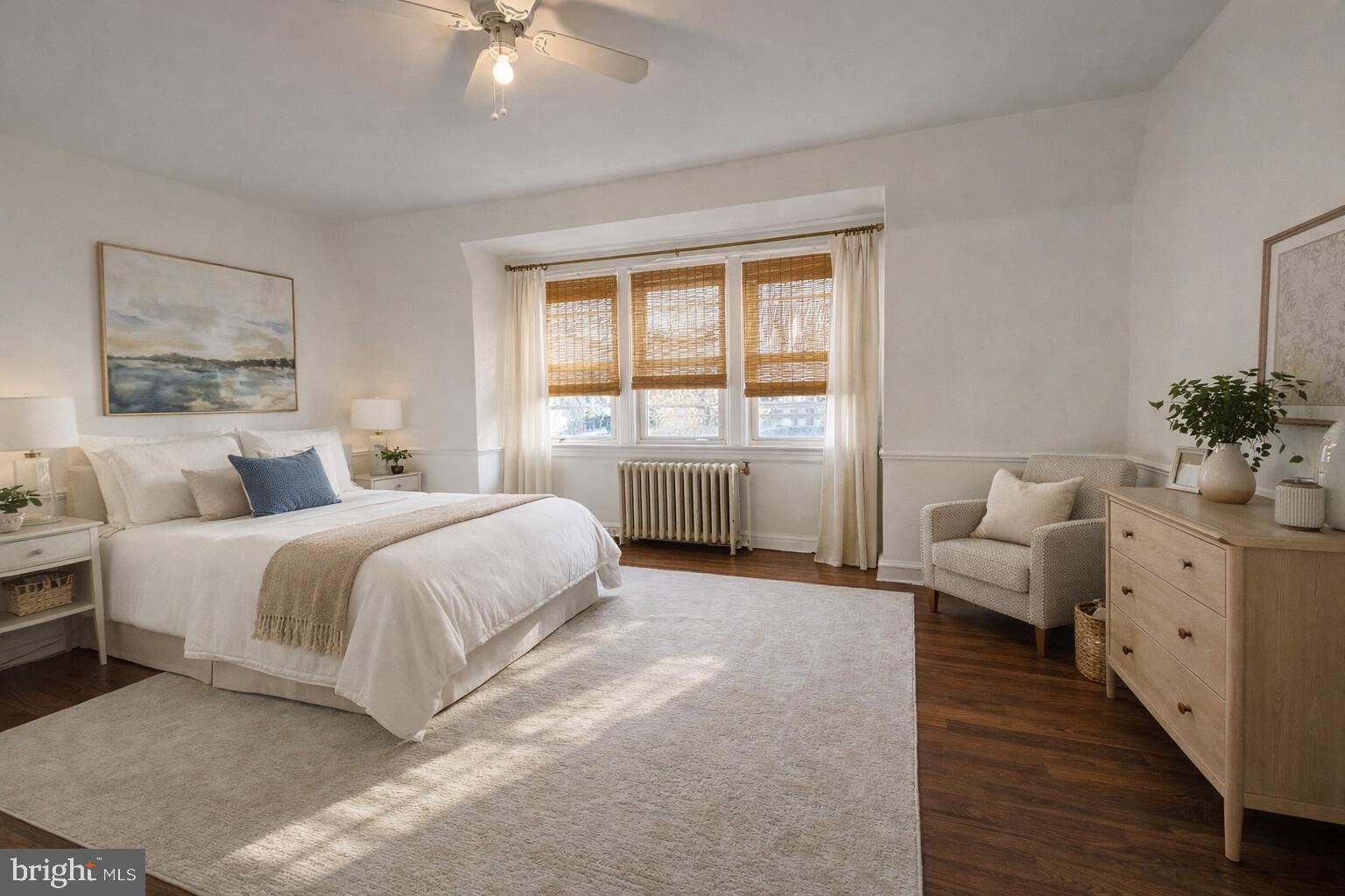 447 West Chester Pike Havertown, PA 19083 - Photo 8 of 16 a spacious bedroom with a large bed and a chandelier