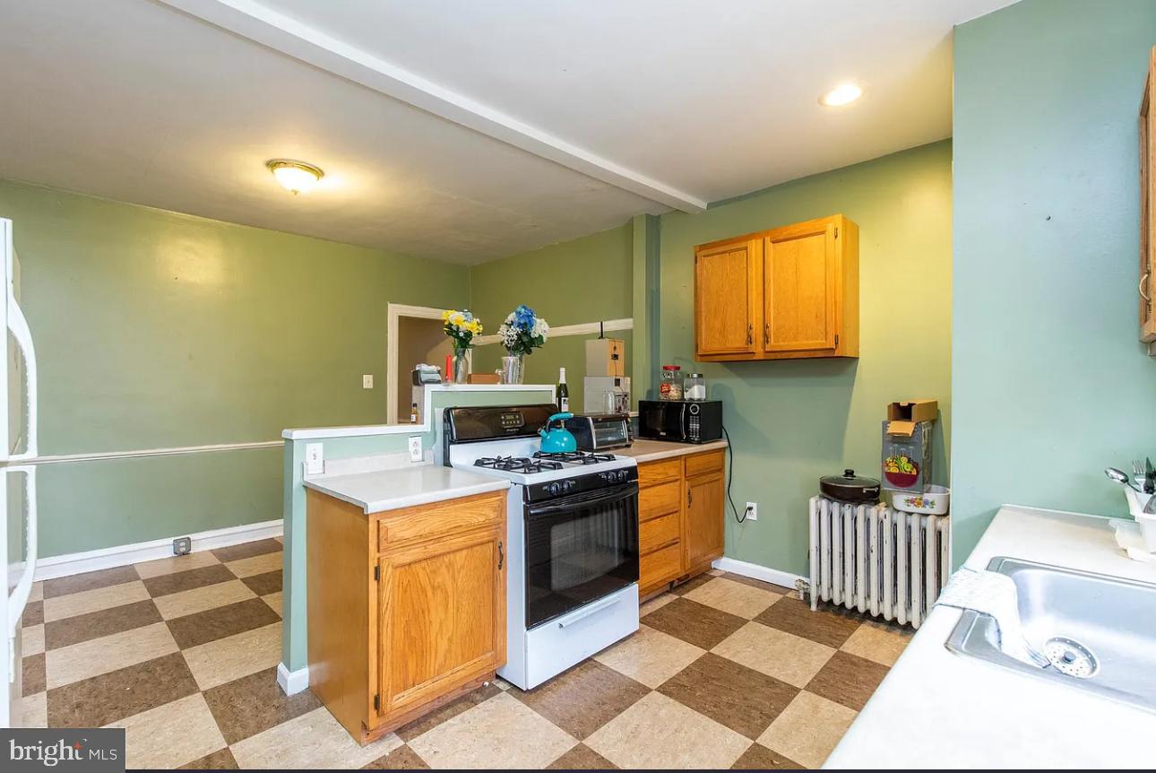 447 West Chester Pike Havertown, PA 19083 - Photo 9 of 16 a kitchen that has a sink and a stove in it