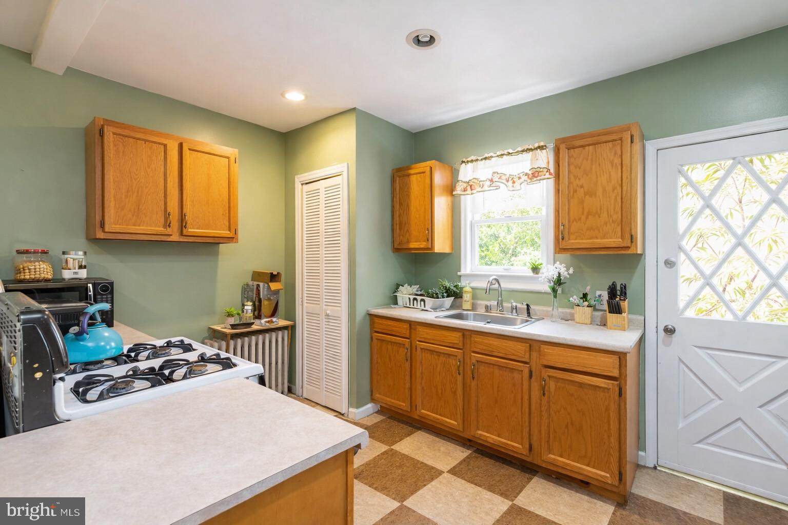 447 West Chester Pike Havertown, PA 19083 - Photo 10 of 16 a kitchen with a sink stove and cabinets