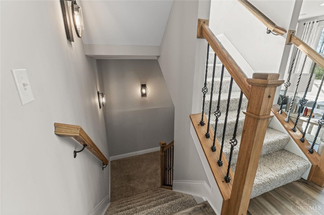 2425 Middleboro Road Clarksville, OH 45113 - Photo 53 of 91 This interior staircase features wood accents and carpeted steps for a comfortable ascent.