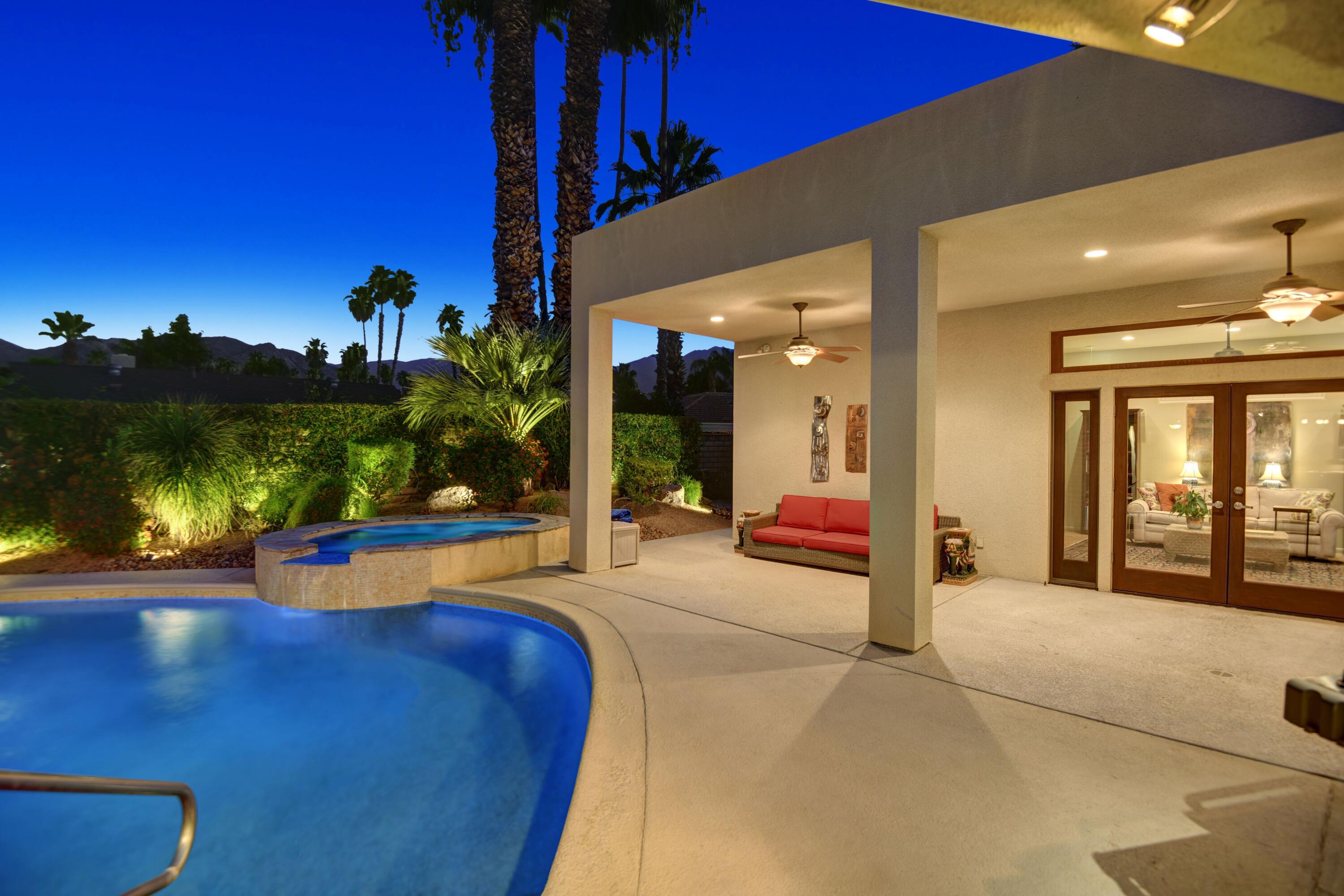 2915 Guadalupe Road Palm Springs, CA 92264 - Photo 11 of 52 a view of a swimming pool with an outdoor seating and a yard