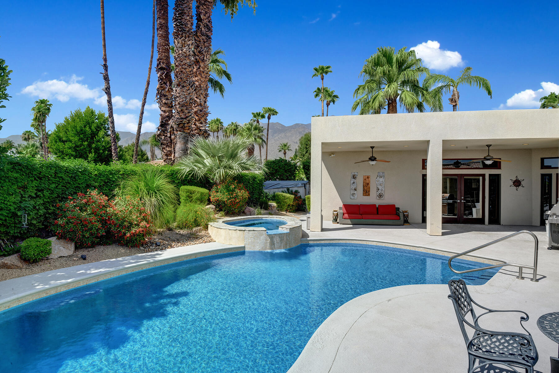 2915 Guadalupe Road Palm Springs, CA 92264 - Photo 24 of 52 a view of a patio with table and chairs plants and potted plants