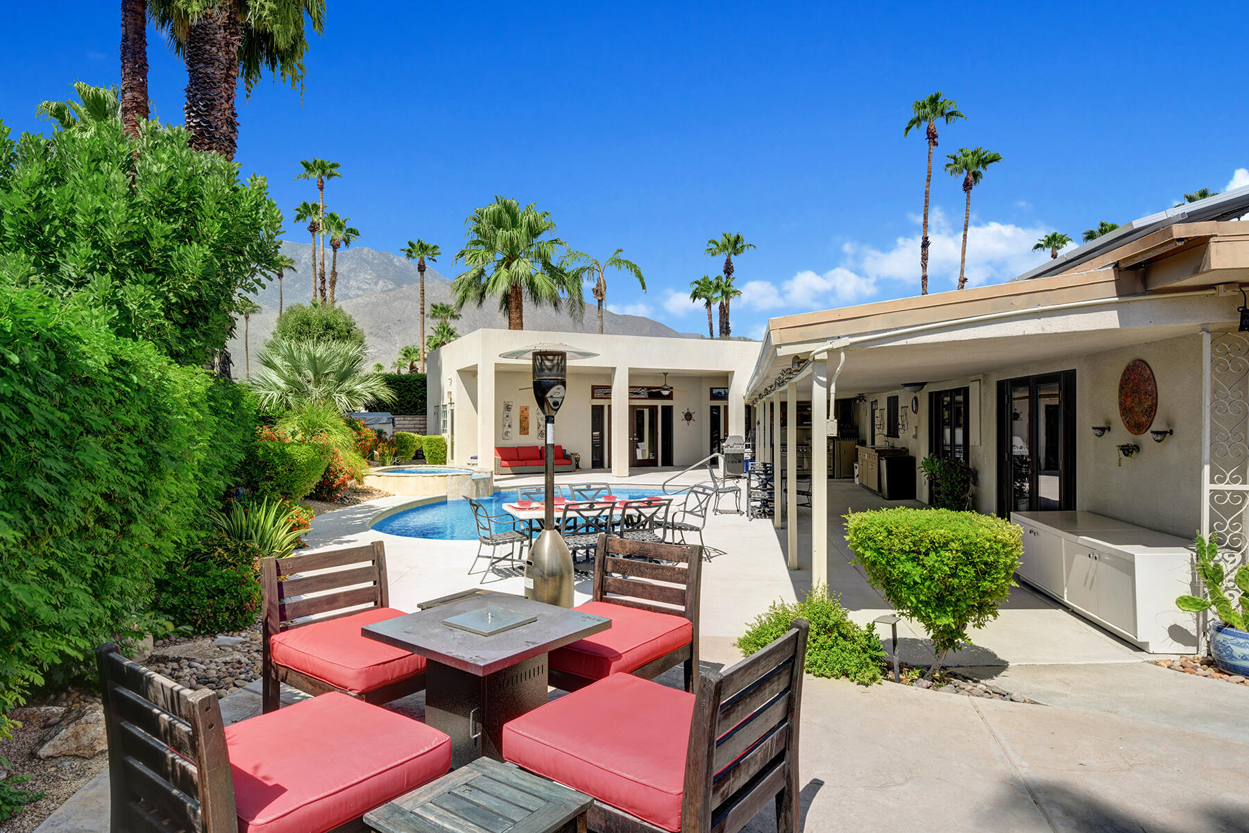 2915 Guadalupe Road Palm Springs, CA 92264 - Photo 26 of 52 a view of a patio with table and chairs and potted plants