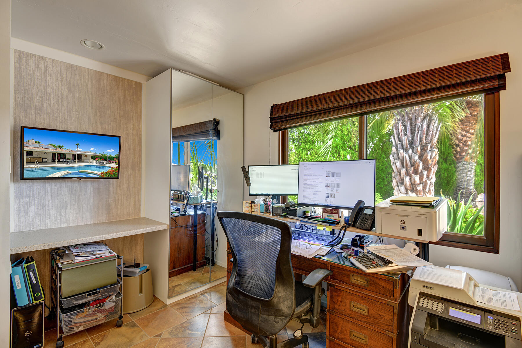 2915 Guadalupe Road Palm Springs, CA 92264 - Photo 36 of 52 a view of a workspace with furniture and a window