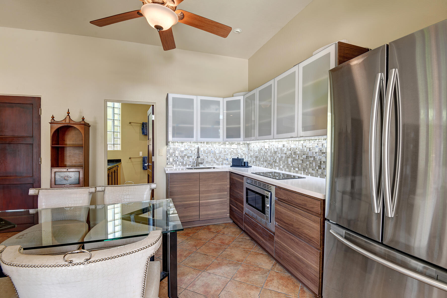 2915 Guadalupe Road Palm Springs, CA 92264 - Photo 47 of 52 a kitchen with stainless steel appliances granite countertop a refrigerator and a stove