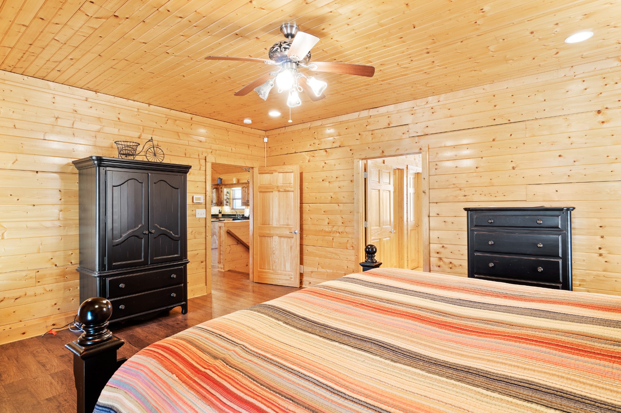 1760 Point Pleasant Road Buchanan, TN 38222 - Photo 32 of 50 a bedroom with a bed and a chandelier