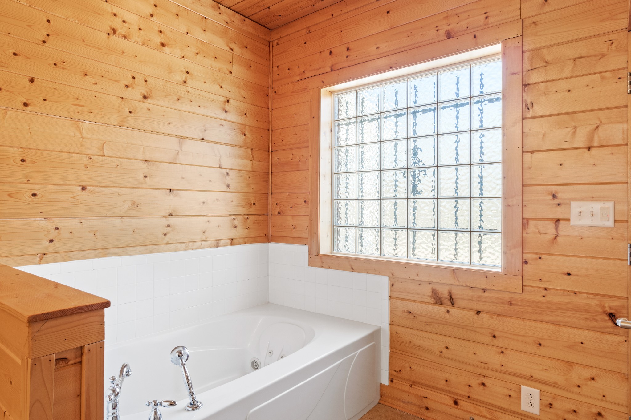 1760 Point Pleasant Road Buchanan, TN 38222 - Photo 34 of 50 a bathroom with bathtub and window