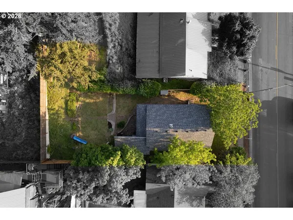 a view of a garden with a house