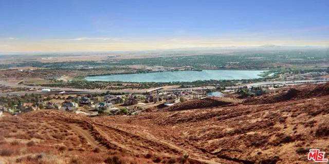 an aerial view of residential building and ocean