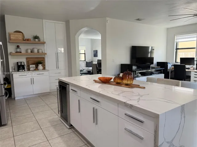 a kitchen with a sink and a stove top oven