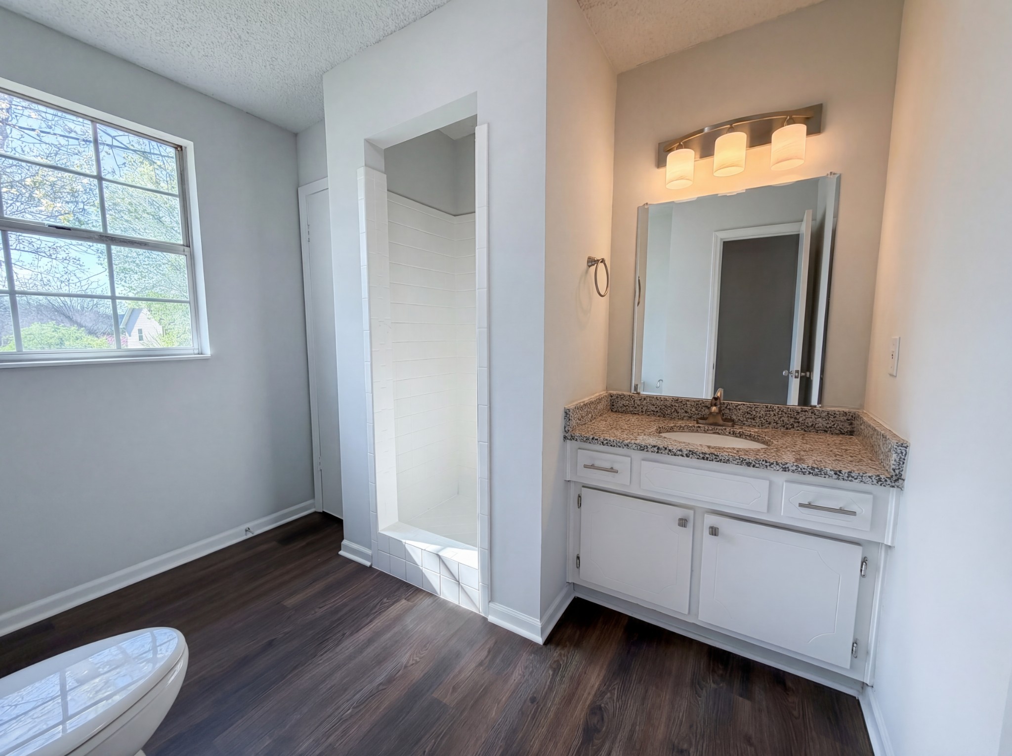 5148 Roxborough Drive Hermitage, TN 37076 - Photo 11 of 19 a room with a mirror and a wooden floor