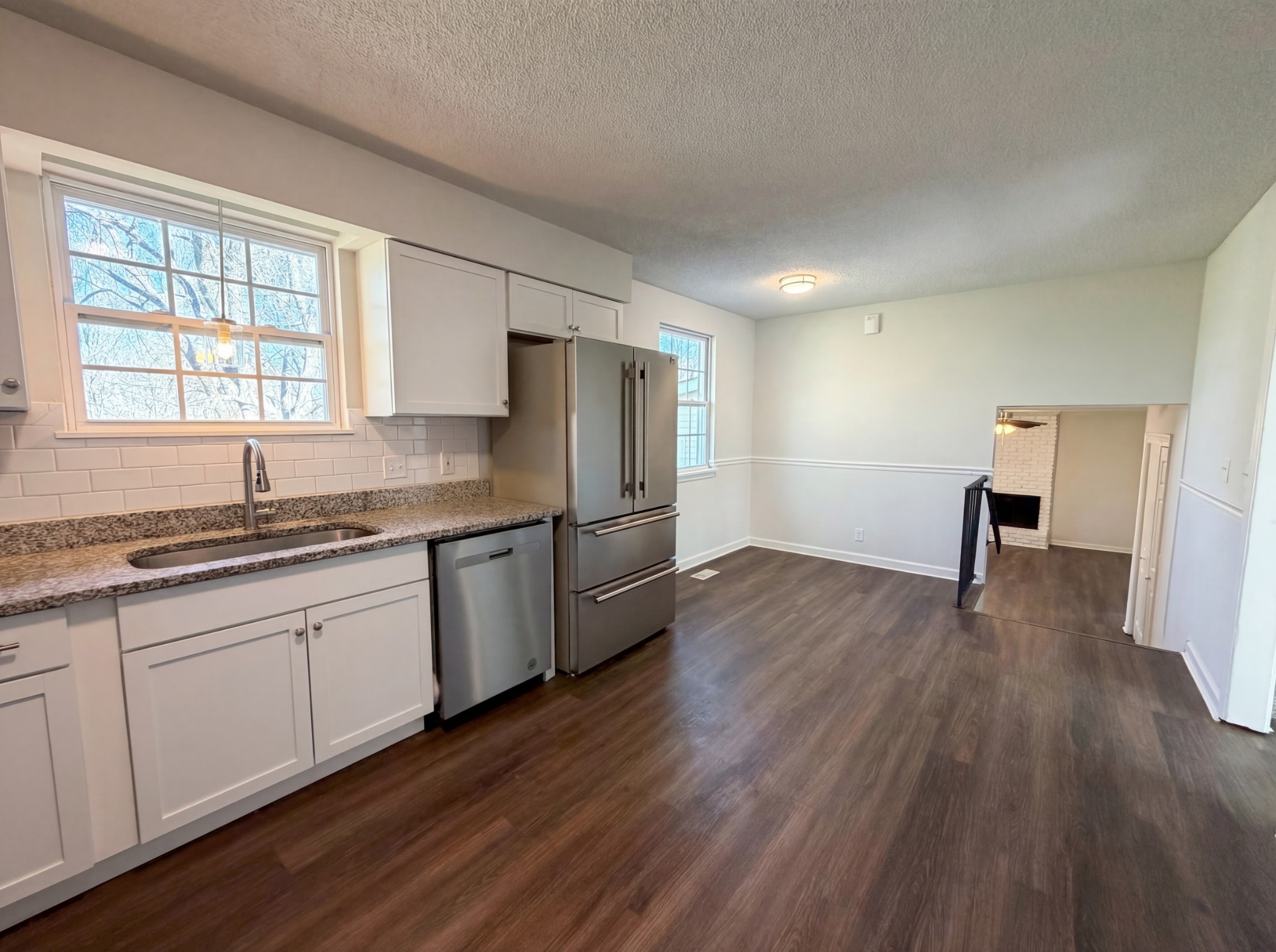 5148 Roxborough Drive Hermitage, TN 37076 - Photo 15 of 19 a kitchen with granite countertop a sink cabinets and wooden floor