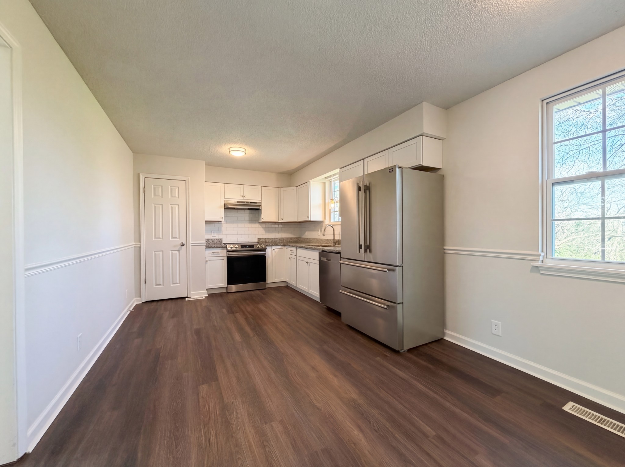 5148 Roxborough Drive Hermitage, TN 37076 - Photo 2 of 19 a kitchen with wooden floors and refrigerator