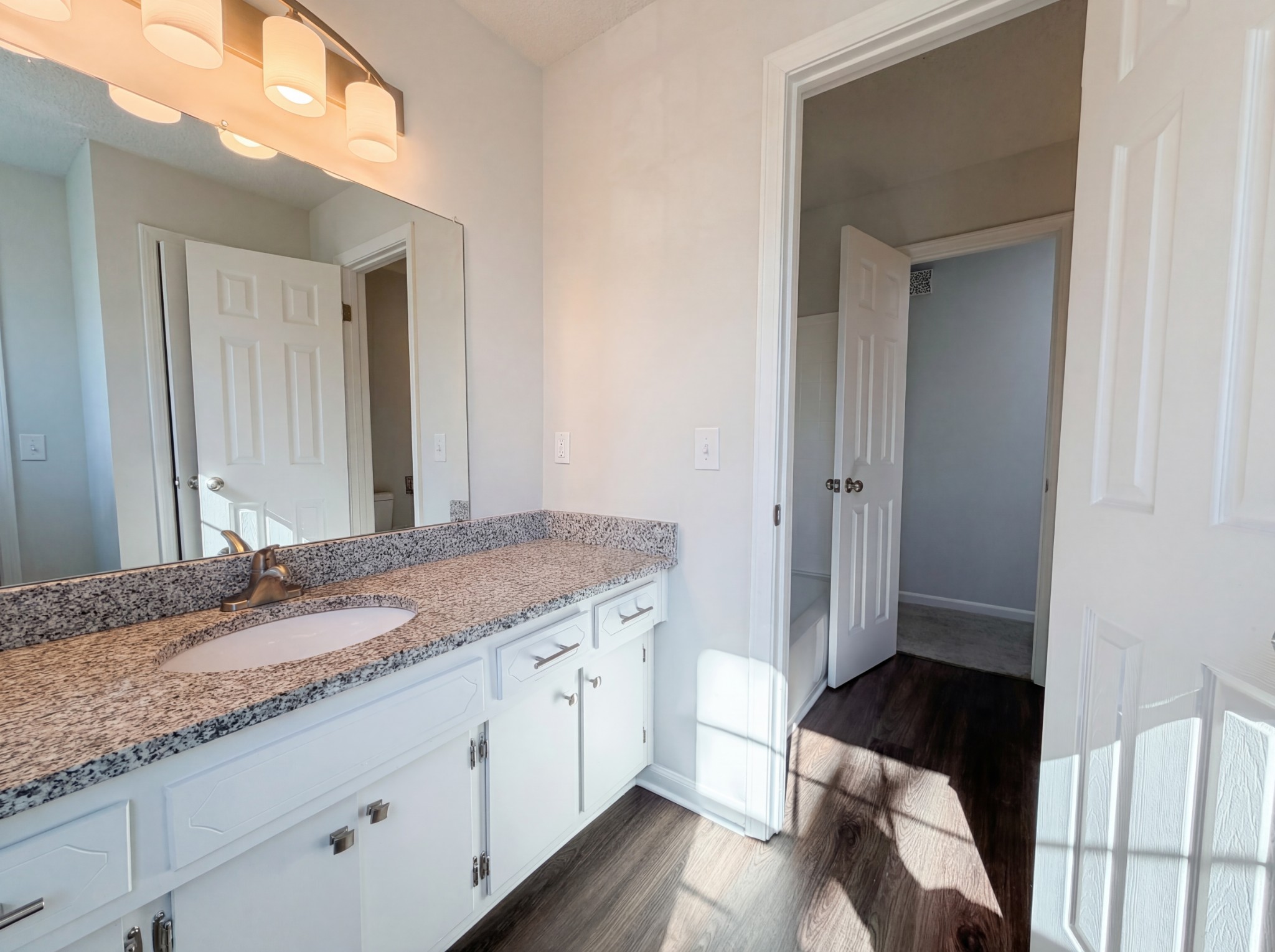 5148 Roxborough Drive Hermitage, TN 37076 - Photo 6 of 19 a bathroom with a granite countertop sink and a mirror
