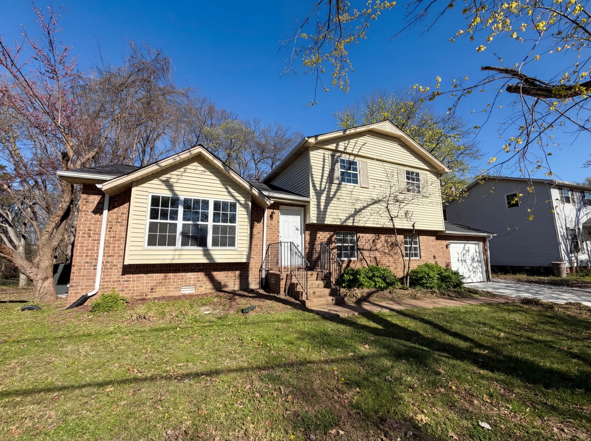 5148 Roxborough Drive Hermitage, TN 37076 - Photo 7 of 19 a front view of a house with garden