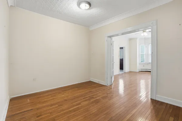 a picture of a bench in front of a building