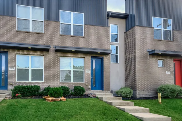 a brick house that is sitting in front of a brick house