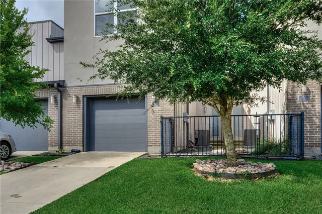a front view of a house with a yard table and chairs