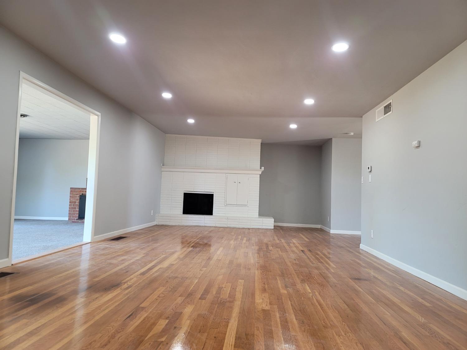 522 Willis Avenue Madera, CA 93637 - Photo 11 of 40 a view of empty room with wooden floor