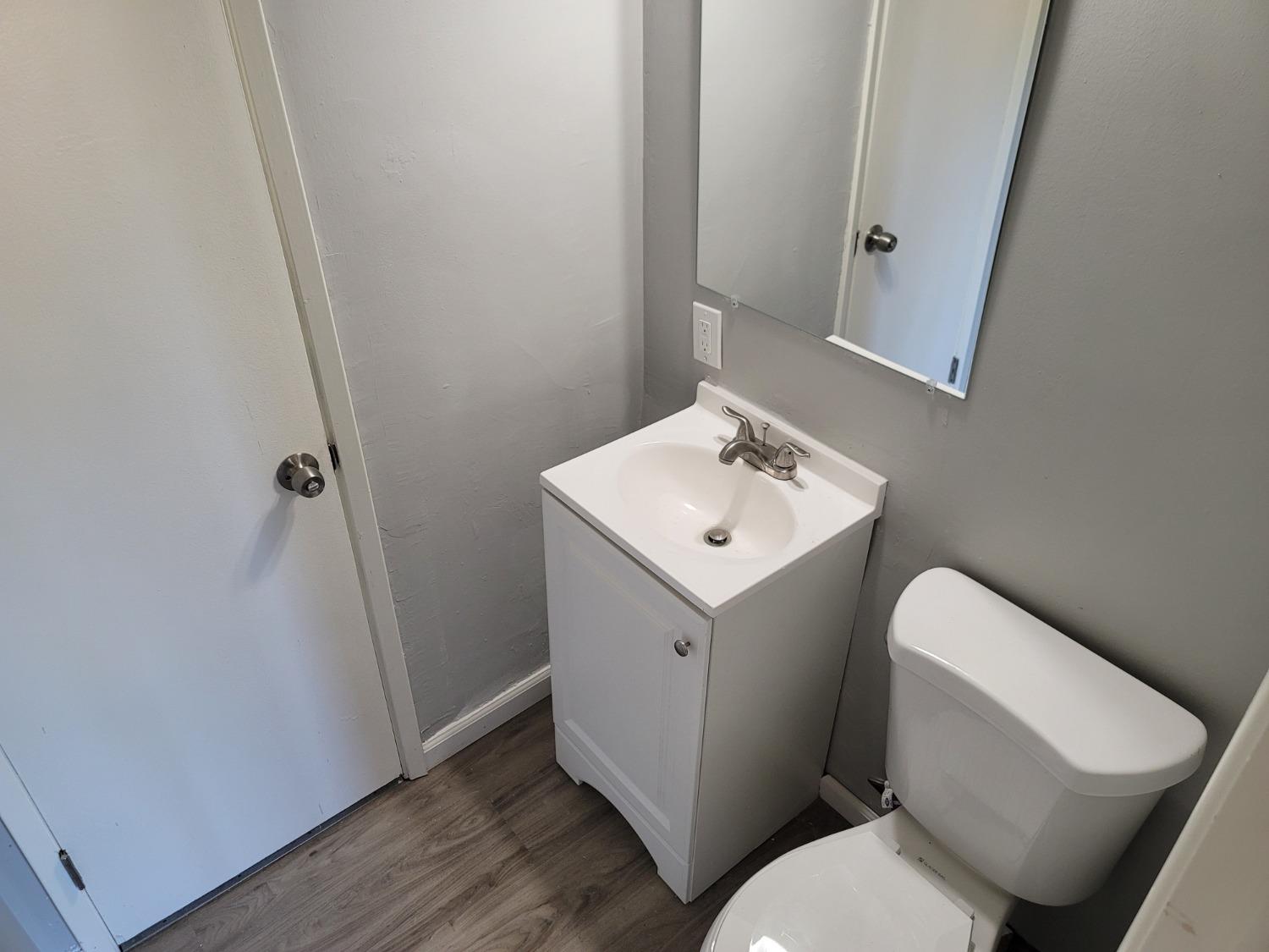 522 Willis Avenue Madera, CA 93637 - Photo 14 of 40 a white toilet sitting next to a white sink