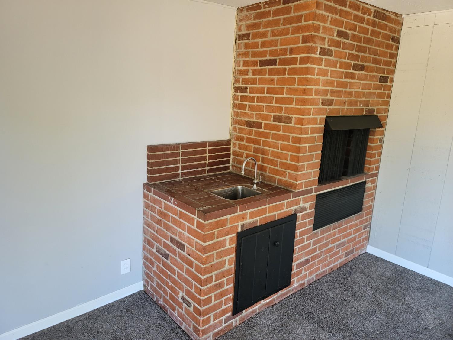 522 Willis Avenue Madera, CA 93637 - Photo 19 of 40 a view of an empty room with a fireplace