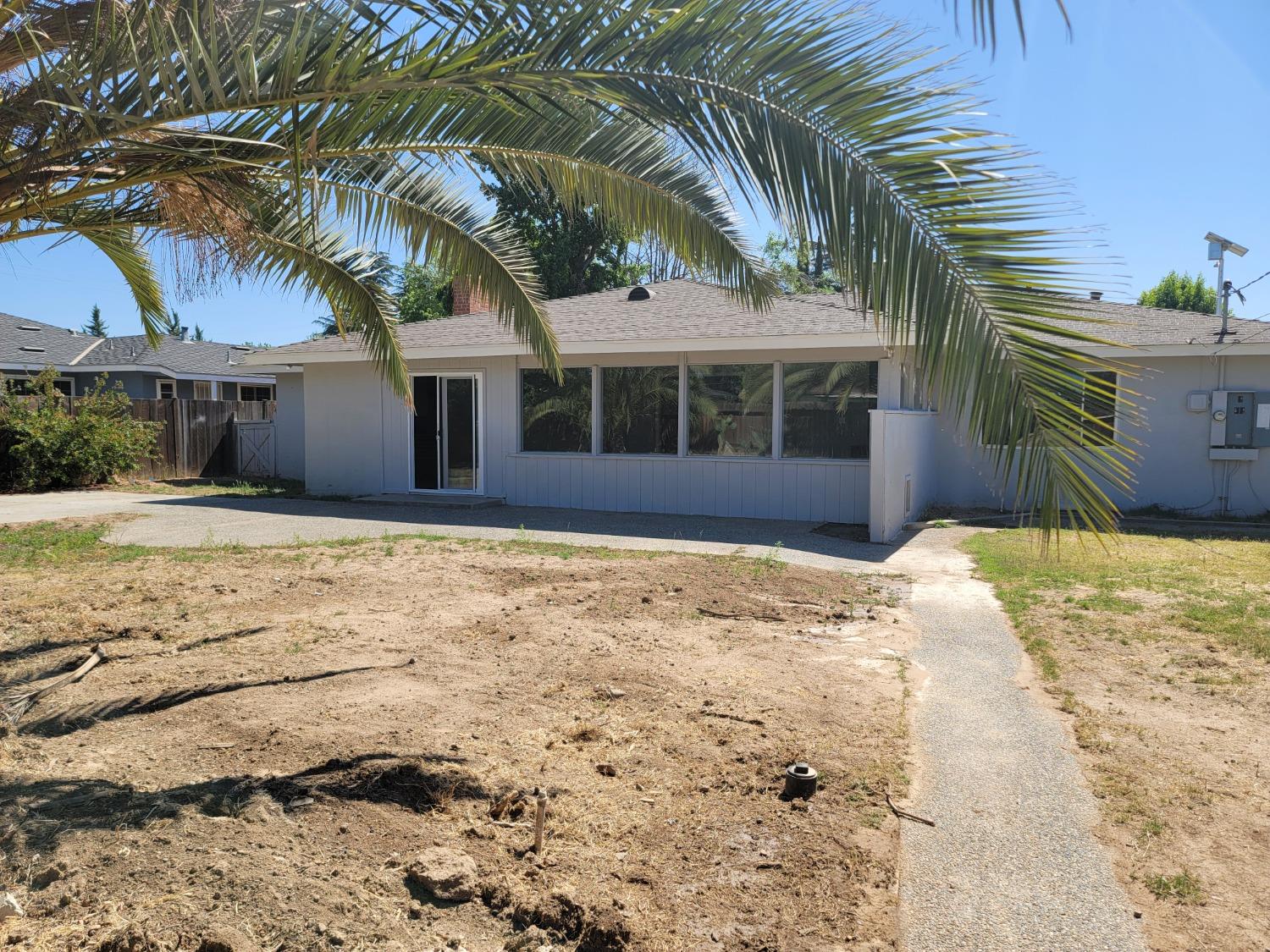 522 Willis Avenue Madera, CA 93637 - Photo 34 of 40 a front view of a house with a yard