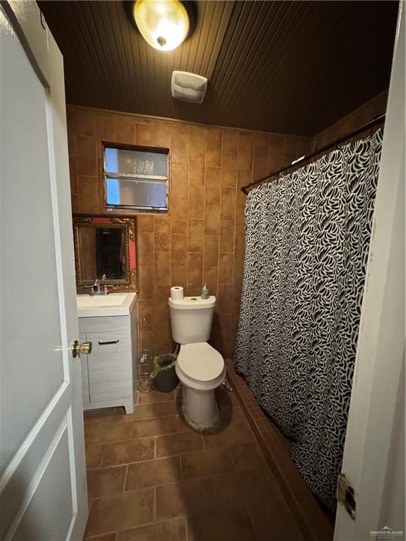 3757 Tom Gill Road Penitas, TX 78576 - Photo 4 of 12 a bathroom with a toilet and a shower