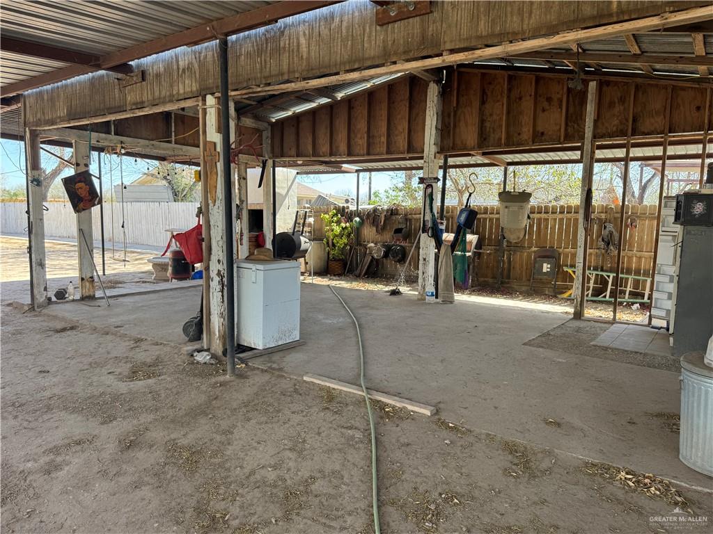 3757 Tom Gill Road Penitas, TX 78576 - Photo 9 of 12 a view of a garage with a table and chairs