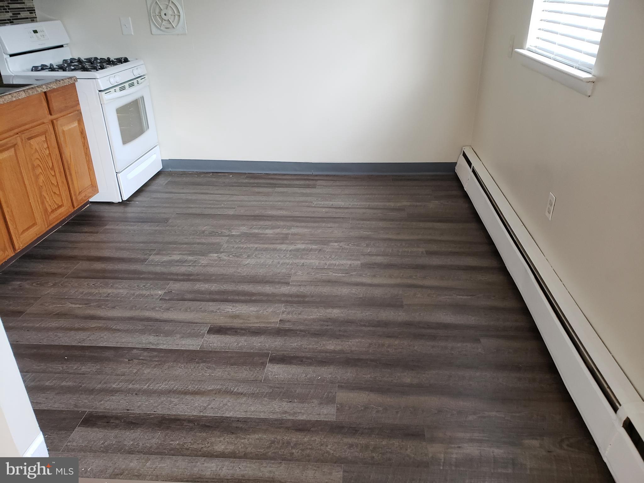737-39 Borbeck Avenue, Unit D Philadelphia, PA 19111 - Photo 8 of 17 a view of a hallway with wooden floor and staircase