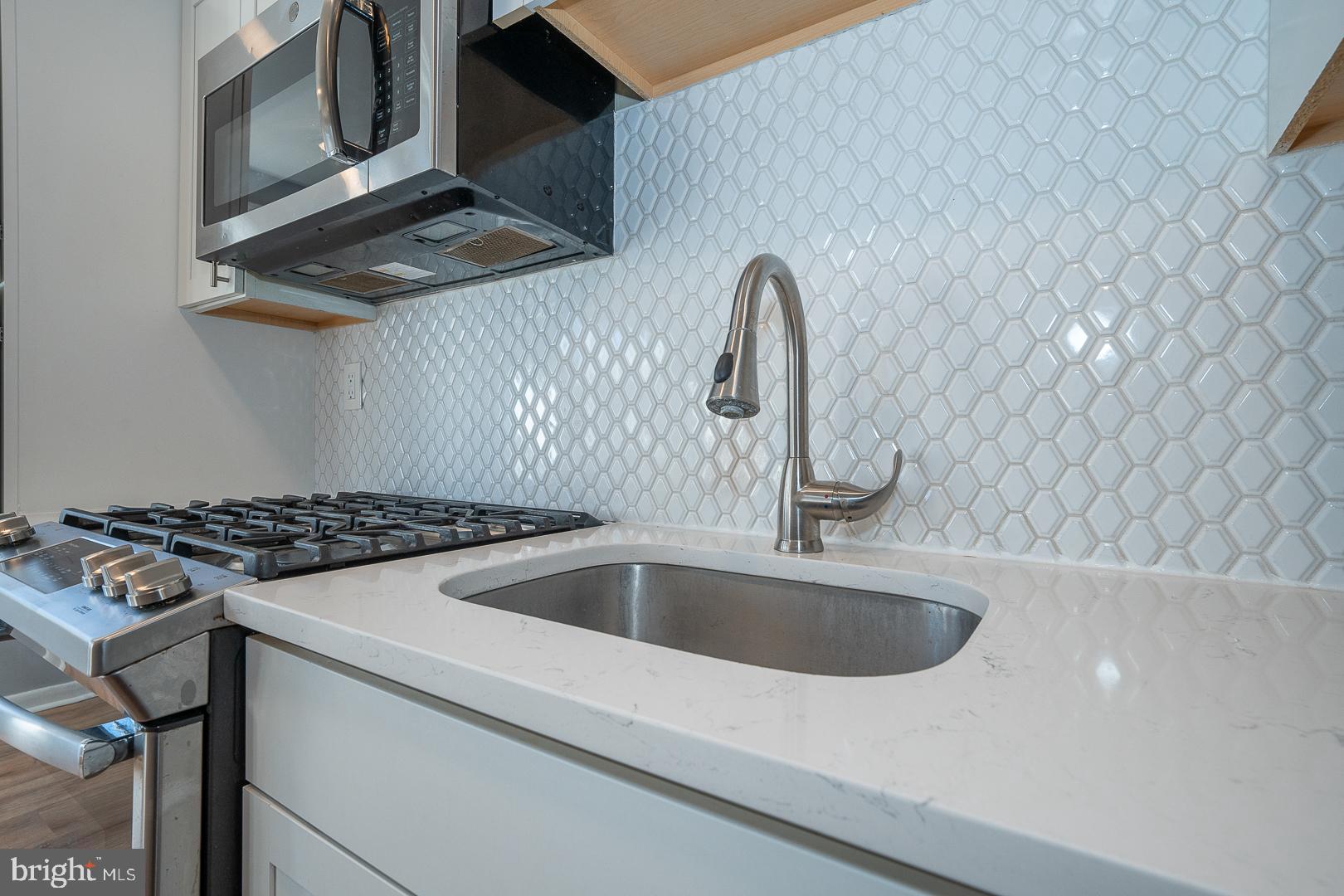 601 Briarcliff Road Upper Darby, PA 19082 - Photo 22 of 63 a close view of a sink and a stove