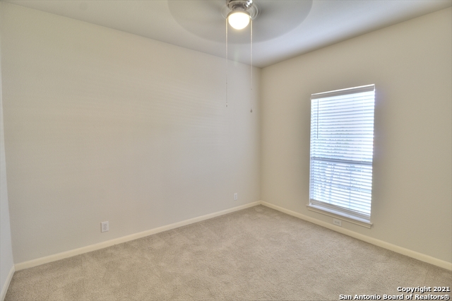9902 Tezel Road San Antonio, TX 78254 - Photo 9 of 12 an empty room with windows