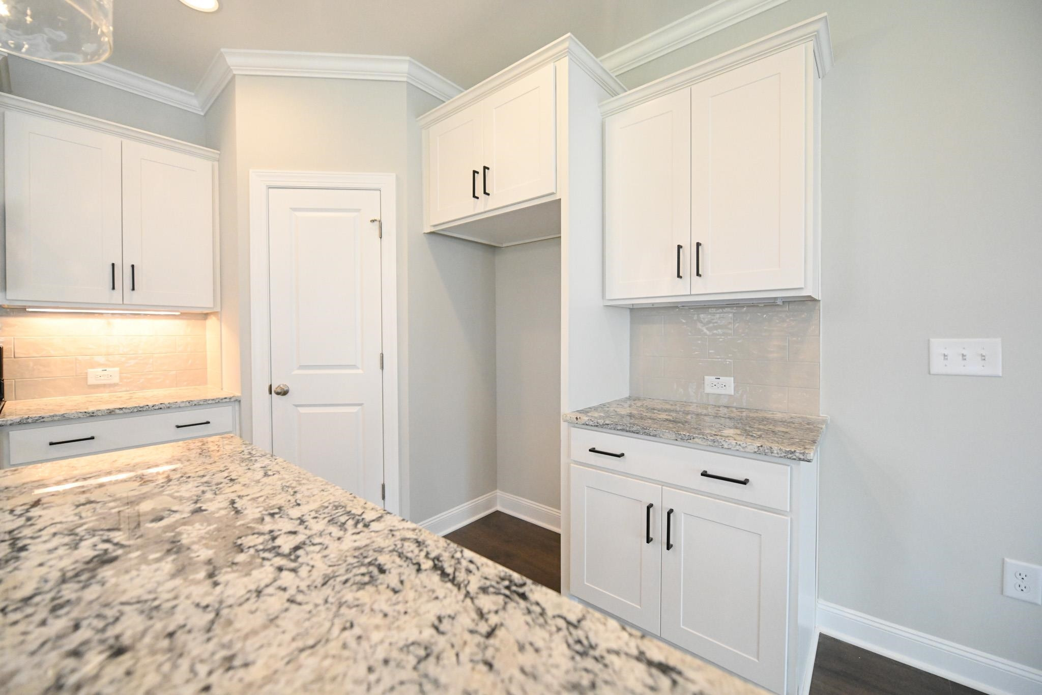 110 Freewill Place Raleigh, NC 27603 - Photo 14 of 39 a kitchen with granite countertop a stove a sink and a refrigerator