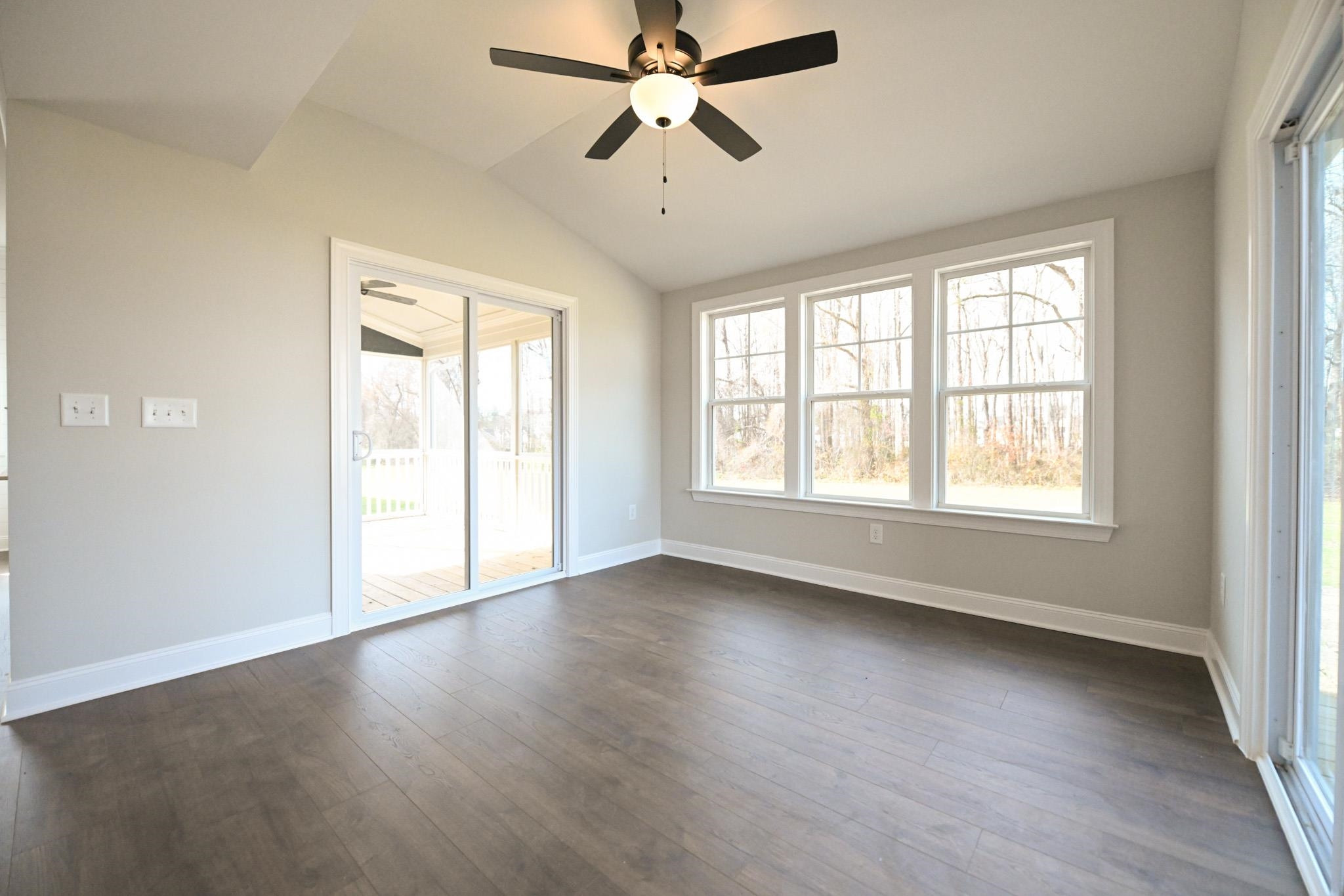 110 Freewill Place Raleigh, NC 27603 - Photo 18 of 39 a view of an empty room with wooden floor and a window