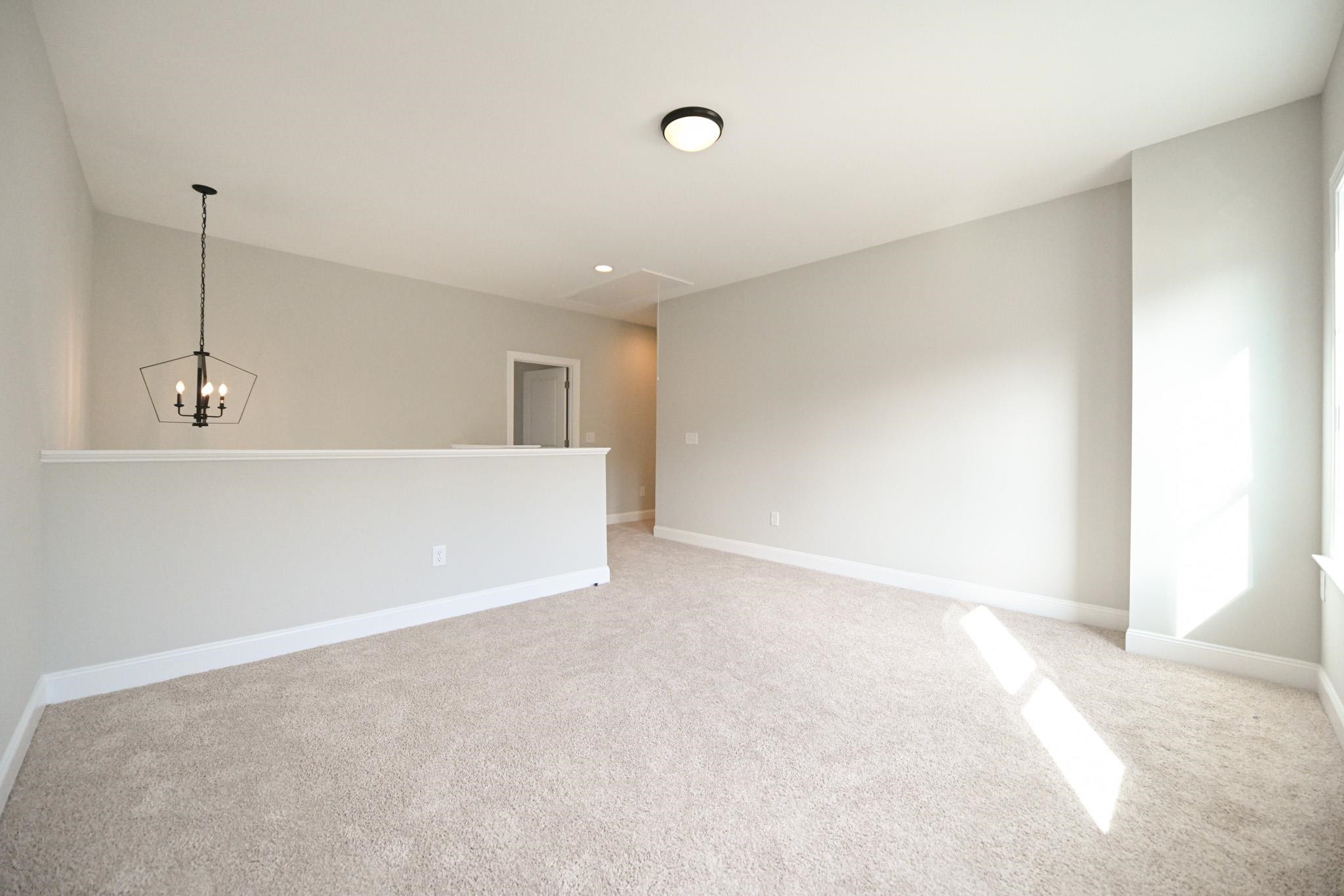 110 Freewill Place Raleigh, NC 27603 - Photo 21 of 39 a view of an empty room with a window