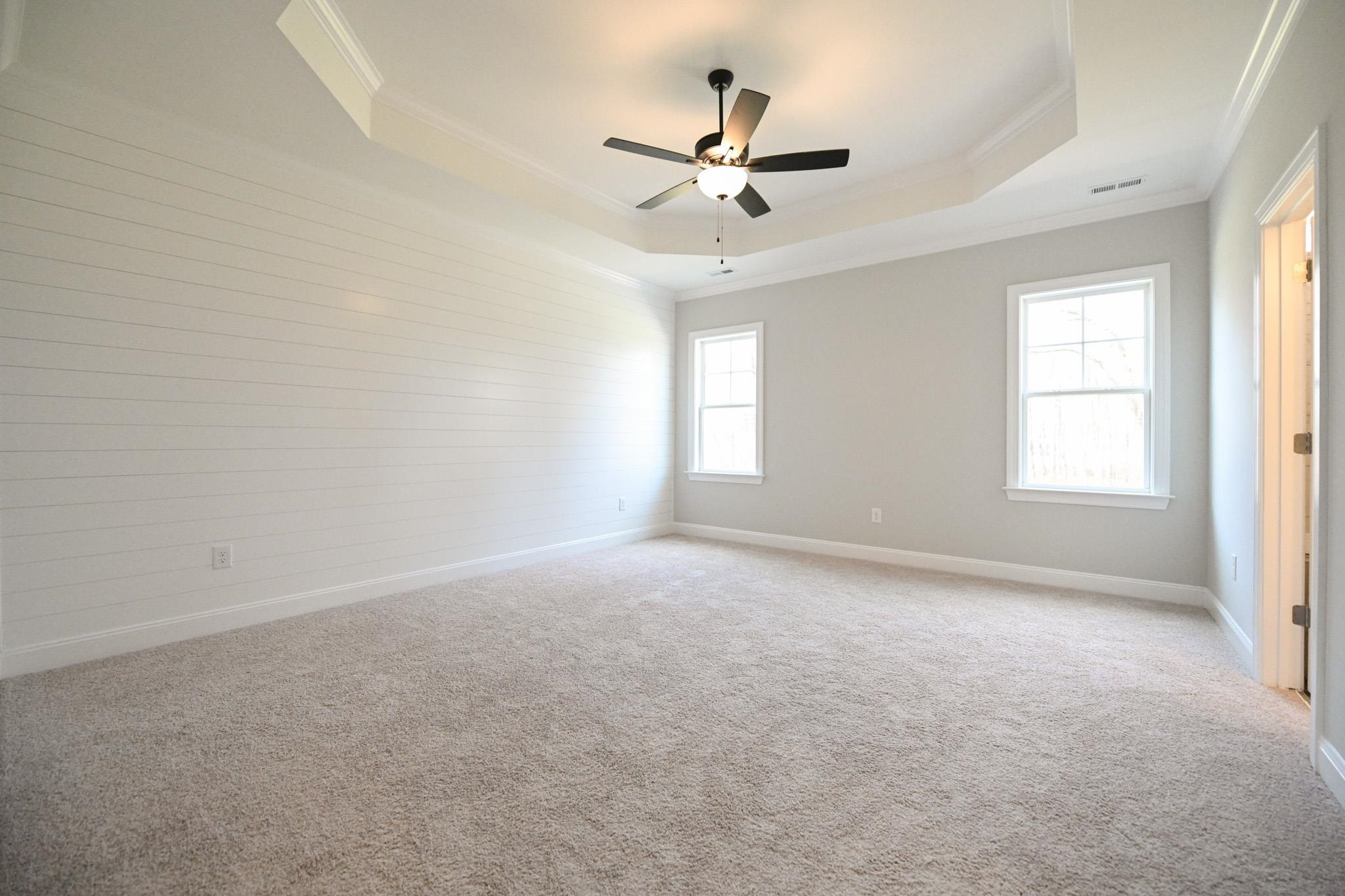 110 Freewill Place Raleigh, NC 27603 - Photo 22 of 39 a view of a livingroom with a ceiling fan and window