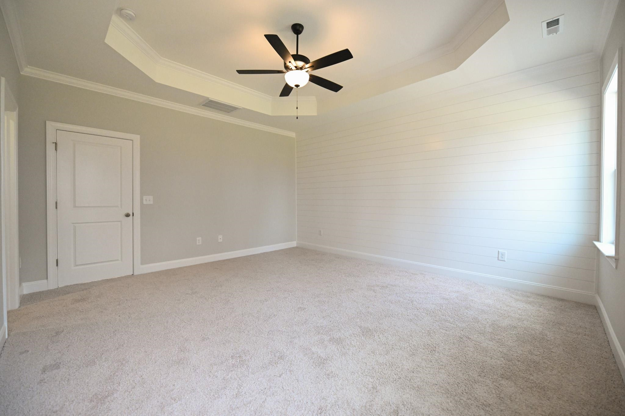 110 Freewill Place Raleigh, NC 27603 - Photo 24 of 39 an empty room with a ceiling fan and wooden floor