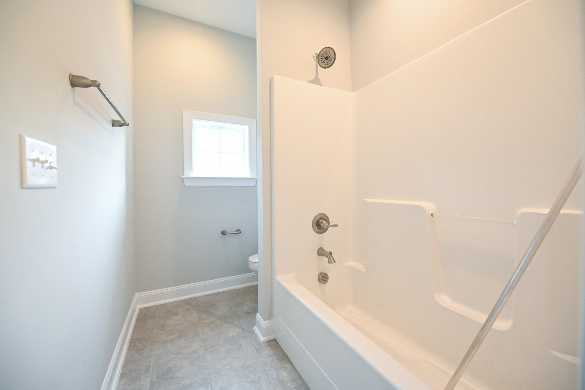 110 Freewill Place Raleigh, NC 27603 - Photo 31 of 39 a bathroom with a bathtub and shower