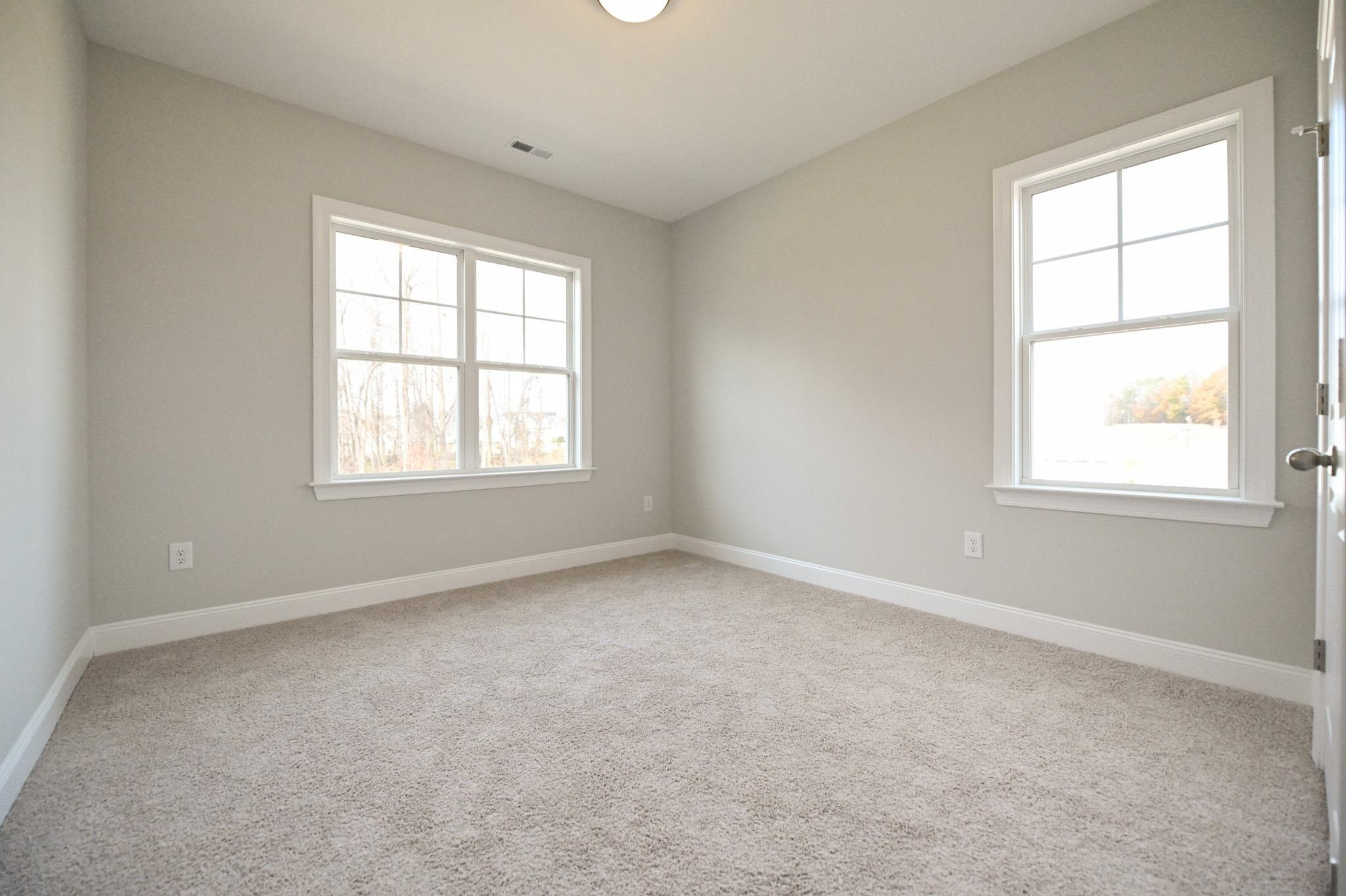 110 Freewill Place Raleigh, NC 27603 - Photo 32 of 39 an empty room with a window