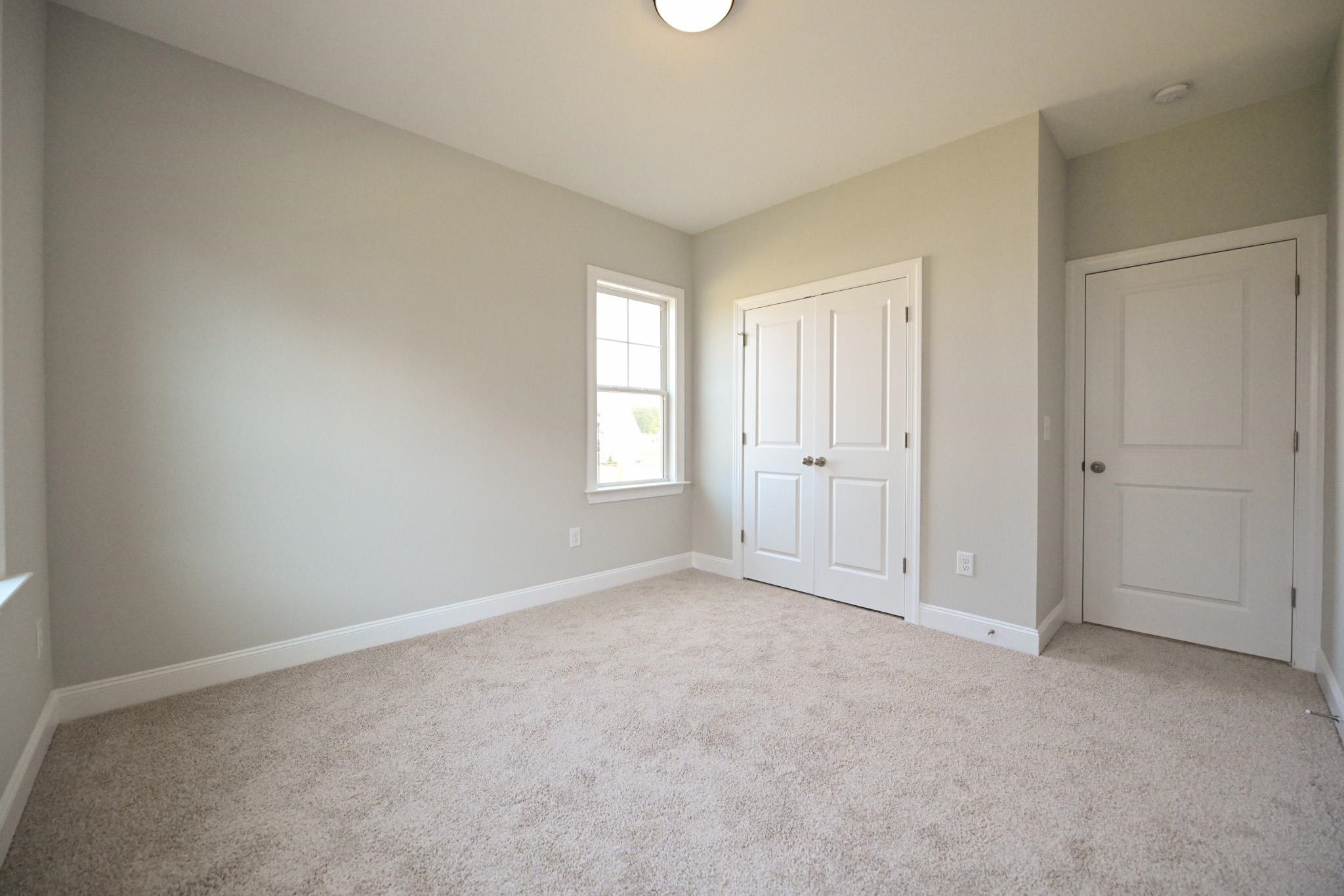 110 Freewill Place Raleigh, NC 27603 - Photo 33 of 39 an empty room with windows