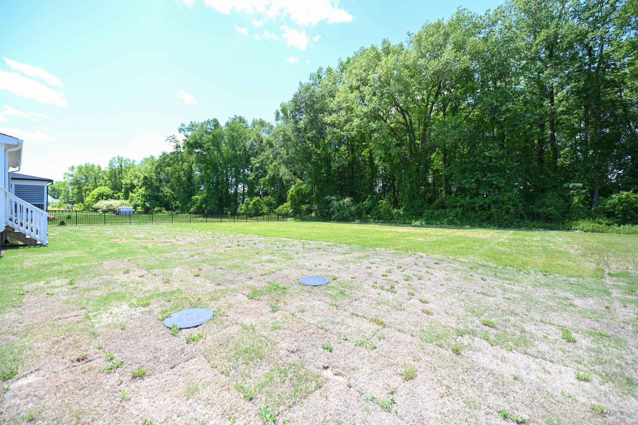 110 Freewill Place Raleigh, NC 27603 - Photo 37 of 39 a view of a field with trees in the background