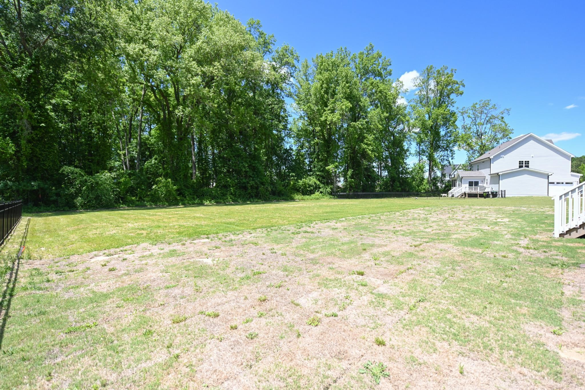 110 Freewill Place Raleigh, NC 27603 - Photo 38 of 39 a view of a trees with a big yard
