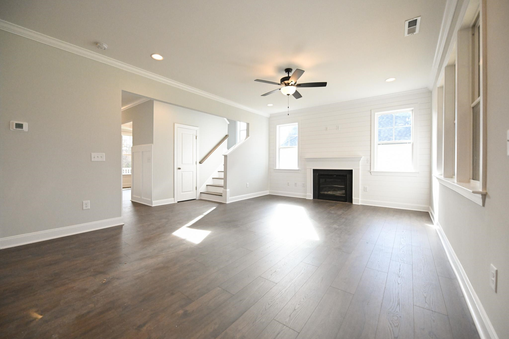 110 Freewill Place Raleigh, NC 27603 - Photo 9 of 39 wooden floor in an empty room with a window