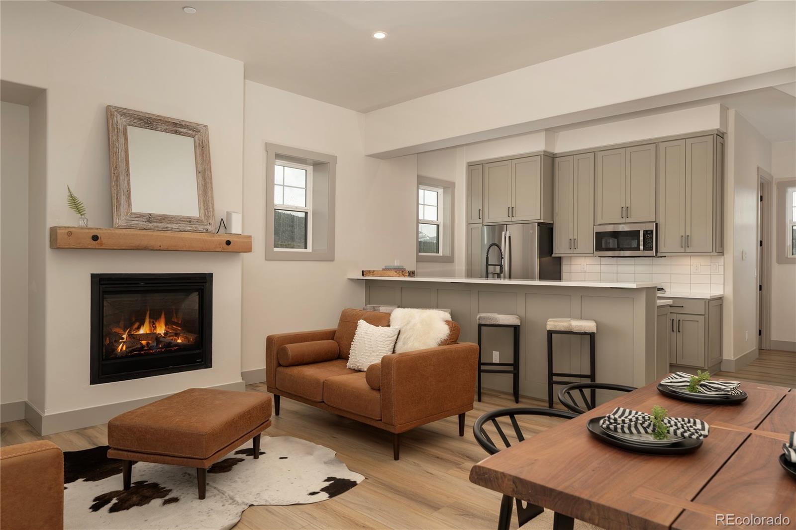 235 Eagle Ridge Circle Granby, CO 80446 - Photo 2 of 34 a living room with furniture and a fireplace