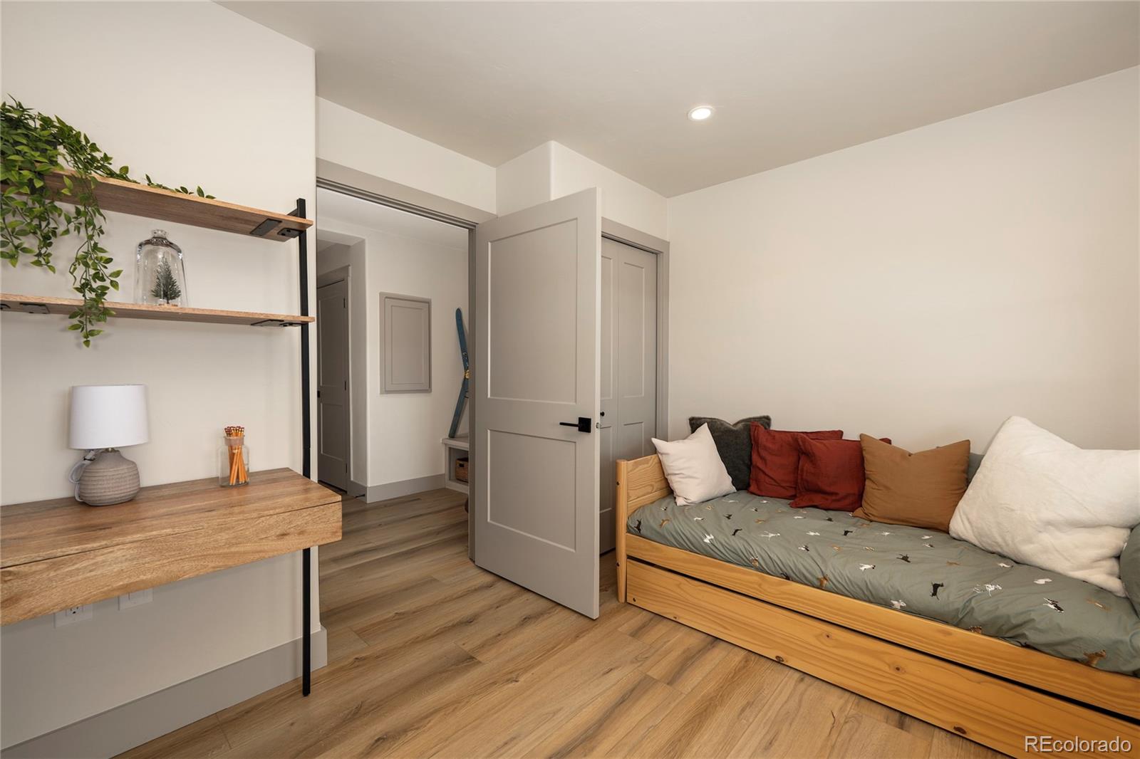 235 Eagle Ridge Circle Granby, CO 80446 - Photo 27 of 34 a living room with furniture and a wooden floor